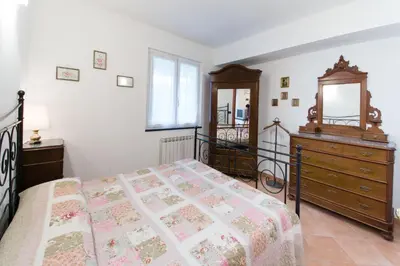 Letto o letti in una camera di Casa Elena