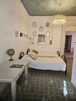 Letto o letti in una camera di Trinacria