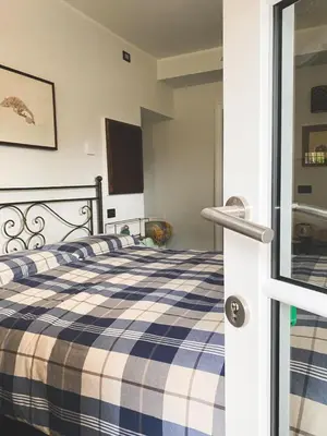 Letto o letti in una camera di Residenza Nemus Vinea Mare e Montagna