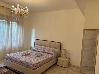 Letto o letti in una camera di WELCOME RIVIERA - Ruentes 87, splendido appartamento vista mare con giardino interamente ristrutturato nel 2025