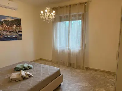 Letto o letti in una camera di WELCOME RIVIERA - Ruentes 87, splendido appartamento vista mare con giardino interamente ristrutturato nel 2025