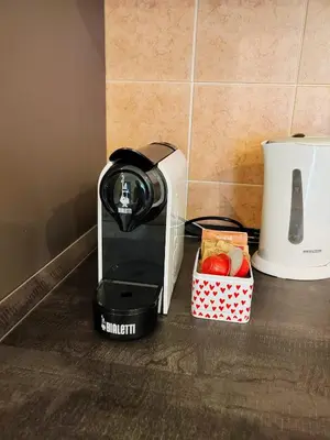Set per la preparazione di tè e caffè presso Elegante bilocale nel cuore di Rubiera