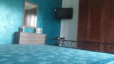 Letto o letti in una camera di Casa Il Sogno