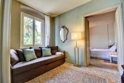 Letto o letti in una camera di Le sorelle - Elegante appartamento fronte mare - 6 posti letto - con posto auto privato