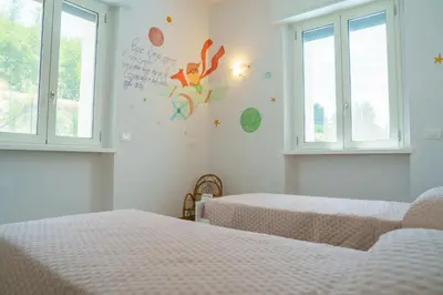 Letto o letti in una camera di Casa Olivieri 05