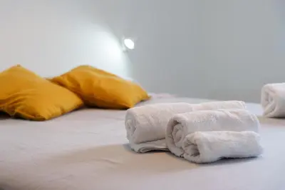Letto o letti in una camera di the riviera attico terrazza