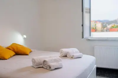 Letto o letti in una camera di the riviera attico terrazza