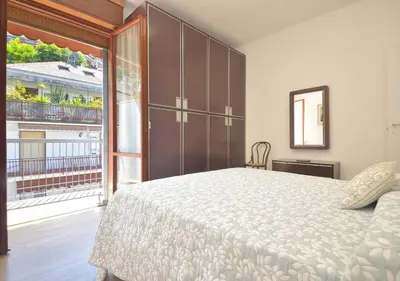 Letto o letti in una camera di Sanguineti Flexyrent apt AC