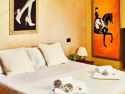 Letto o letti in una camera di Small Luxury A Due Passi Dal Centro