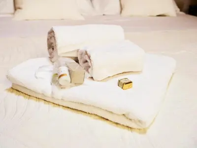 Letto o letti in una camera di Small Luxury A Due Passi Dal Centro