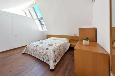 Letto o letti in una camera di Urbino Loft - City Center on foot