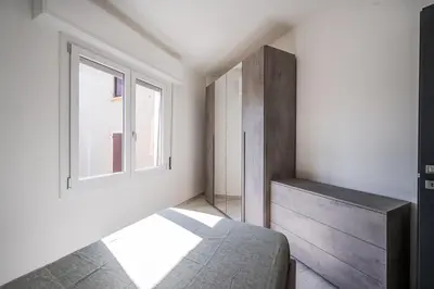 Letto o letti in una camera di Smart Life House in the heart of Modena