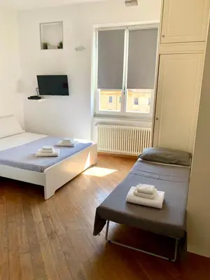 Letto o letti in una camera di Square Apartment in Centro città