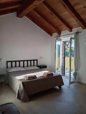 Letto o letti in una camera di Vento di Mare - Tramontana con spiaggia privata