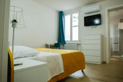 Letto o letti in una camera di Good Vibes apartment centro storico Reggio Emilia