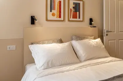 Letto o letti in una camera di Borgo delle Botteghe Luxury Suites
