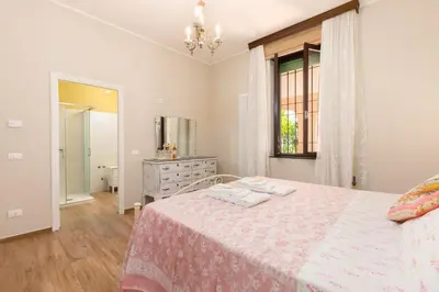 Letto o letti in una camera di La Casa dei Nonni