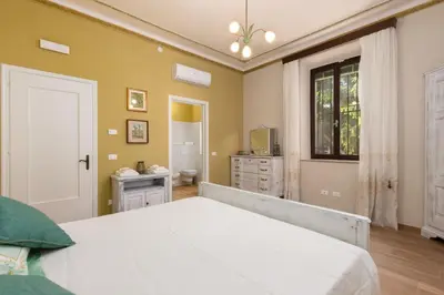 Letto o letti in una camera di La Casa dei Nonni