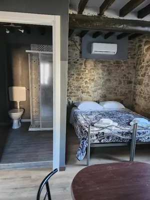 Letto o letti in una camera di Affittacamere LA BOUGANVILLE