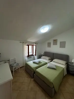Letto o letti in una camera di CA'da LU'