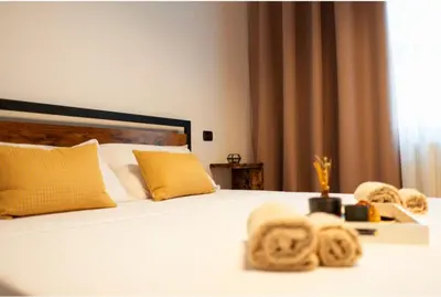 Letto o letti in una camera di Fenili Belasi - apartamento nuovo
