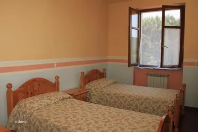 Letto o letti in una camera di Agriturismo La Praduscella
