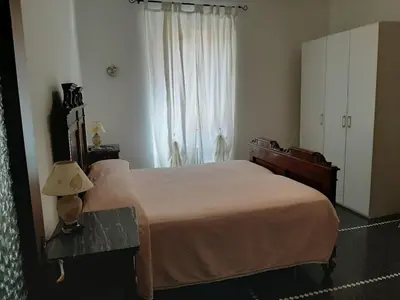 Letto o letti in una camera di casa Nadia