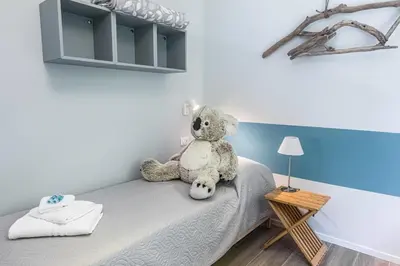 Letto o letti in una camera di La Casa nel Verde - Box auto e Wi-Fi