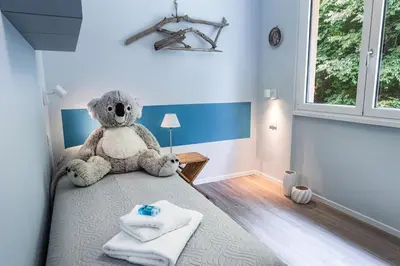 Letto o letti in una camera di La Casa nel Verde - Box auto e Wi-Fi