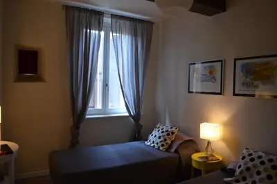 Letto o letti in una camera di Heart of Parma
