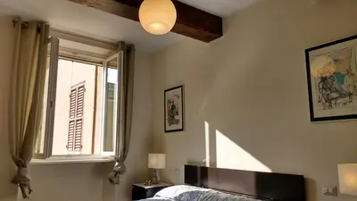 Letto o letti in una camera di Heart of Parma