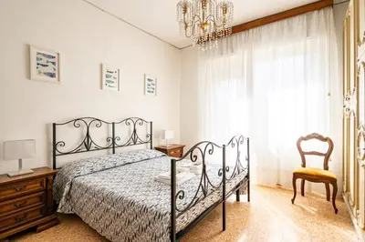 Letto o letti in una camera di GuestHost - Casa Bina