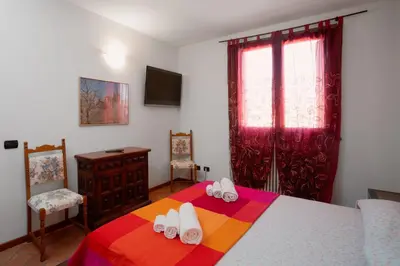 Letto o letti in una camera di PARISI Borgo Virgilio
