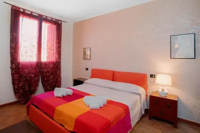 Letto o letti in una camera di PARISI Borgo Virgilio