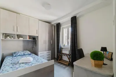 Letto o letti in una camera di La Boutique Apartment