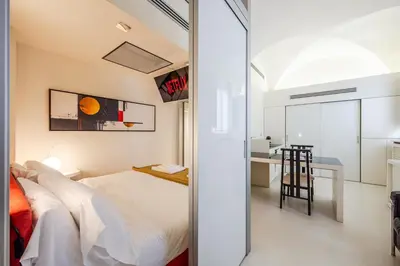 Letto o letti in una camera di Mini-loft just steps from the Duomo of Modena