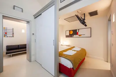 Letto o letti in una camera di Mini-loft just steps from the Duomo of Modena