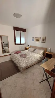 Letto o letti in una camera di Pit Stop - Bilocale inTerra di Motori, Cibo e Arte
