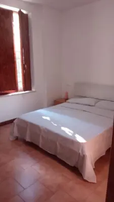 Letto o letti in una camera di Casa Manto