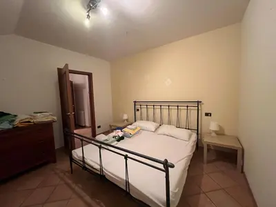 Letto o letti in una camera di UltimacasaLIGURIA