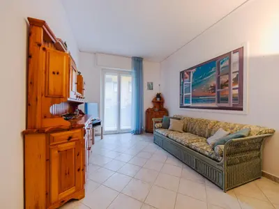 Area soggiorno di Apartment Baia dei Sogni by Interhome