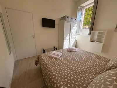 Letto o letti in una camera di Arte, Business e Relax nel cuore di Piacenza