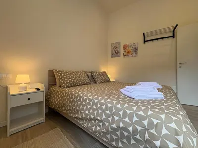 Letto o letti in una camera di Arte, Business e Relax nel cuore di Piacenza