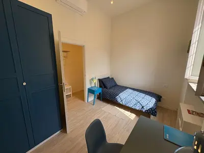 Letto o letti in una camera di Arte, Business e Relax nel cuore di Piacenza