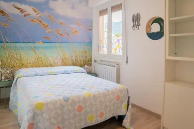Letto o letti in una camera di 073C - Casa Rapallo con Attico privato, 10 minuti dal Mare Spiaggie a piedi