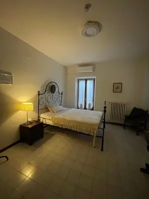 Letto o letti in una camera di Casa Aurora