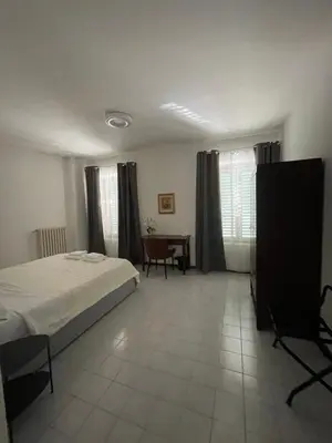 Letto o letti in una camera di Casa Aurora