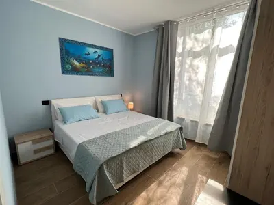 Letto o letti in una camera di Rubiera Sunny Apartments - Luminosi e vicino museo Ferrari