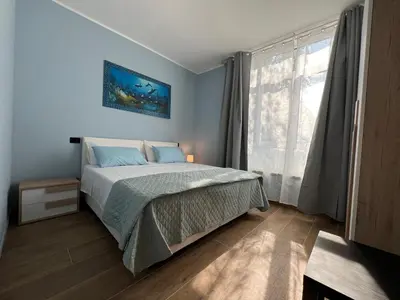 Letto o letti in una camera di Rubiera Sunny Apartments - Luminosi e vicino museo Ferrari