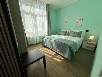 Letto o letti in una camera di Rubiera Sunny Apartments - Luminosi e vicino museo Ferrari